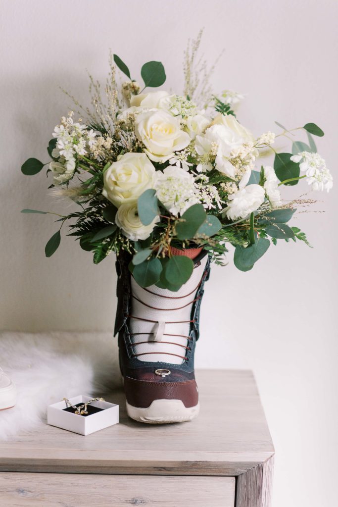 snowboard boot with wedding bouquet