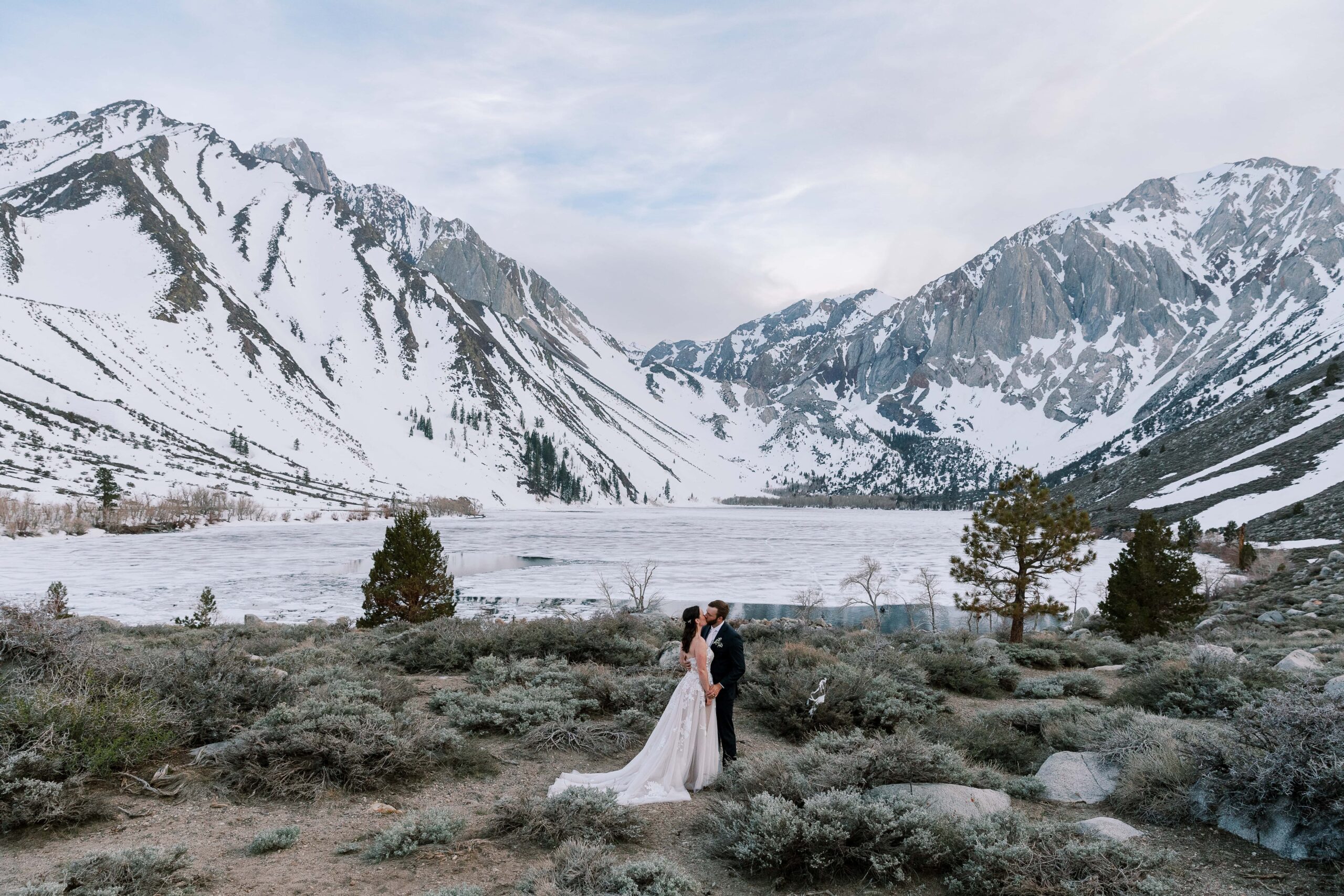 couple kissing at scenic winter convict lake spot