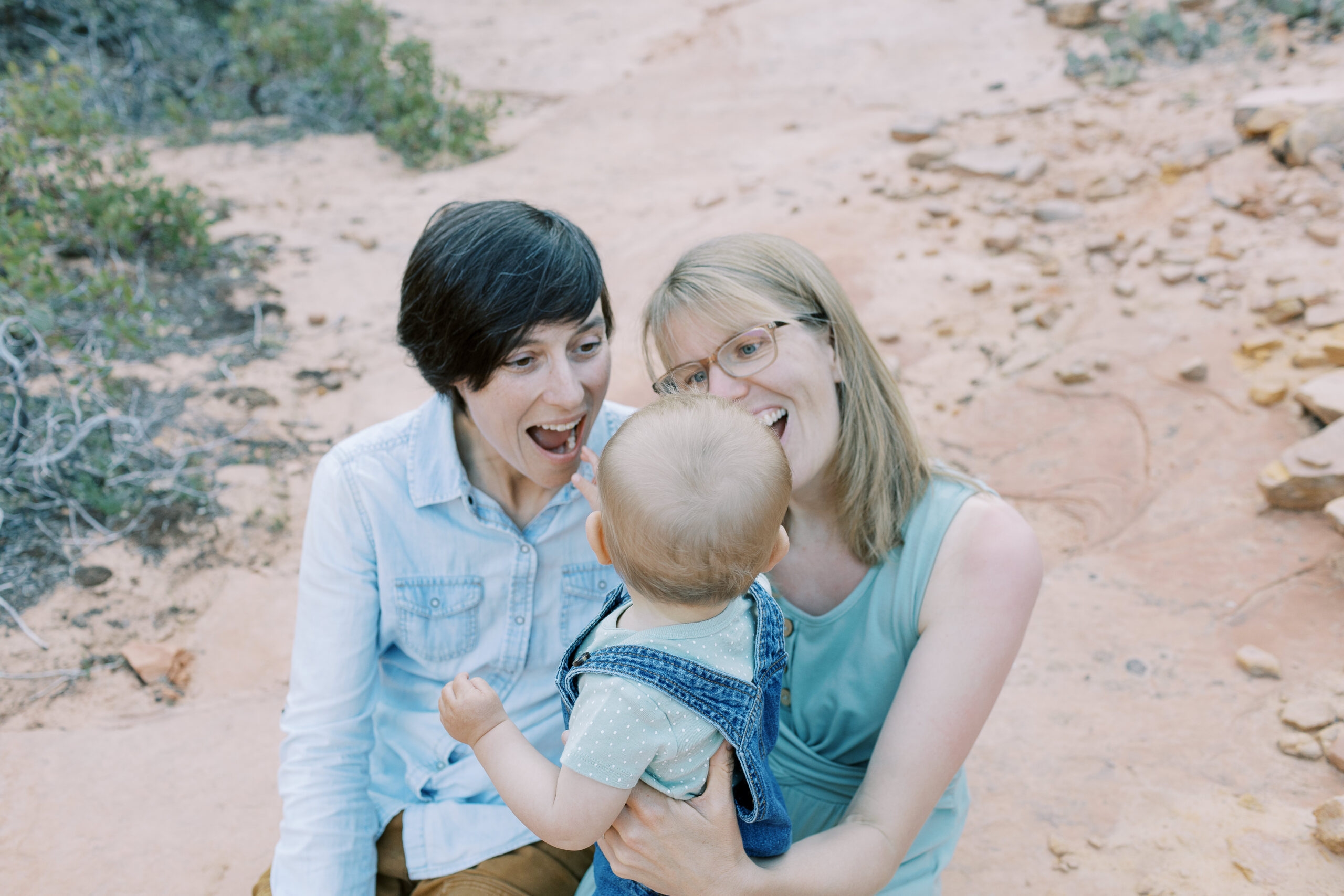 family looking at baby