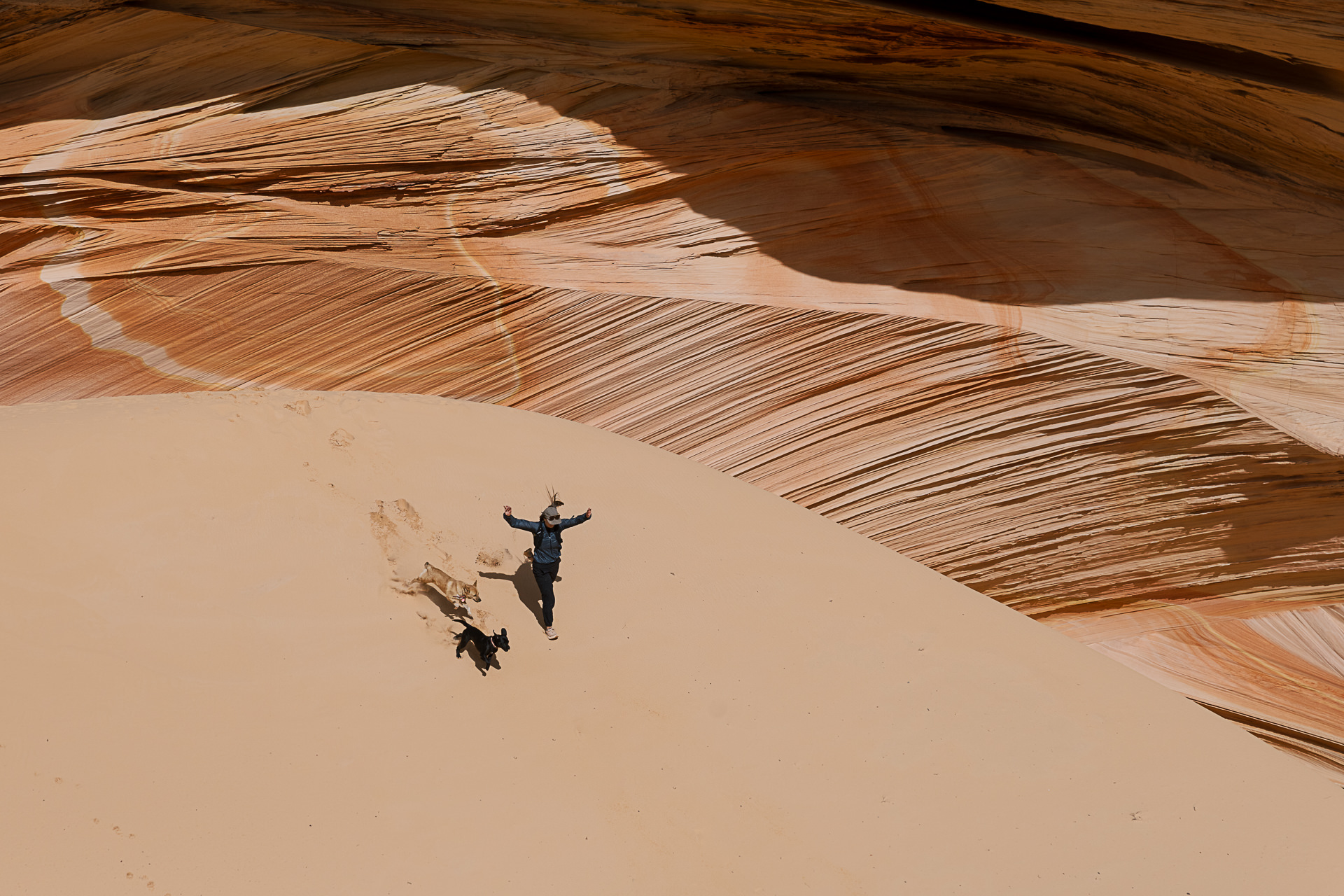 Hikers walking into the sandstone formations