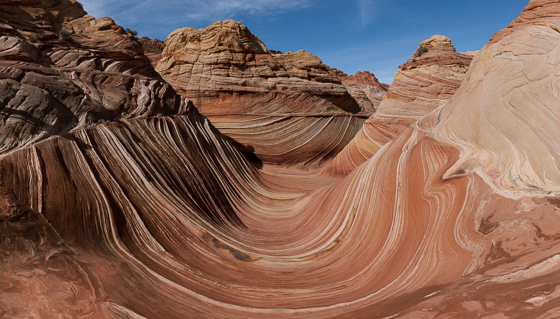 Hikers walking into the sandstone formations