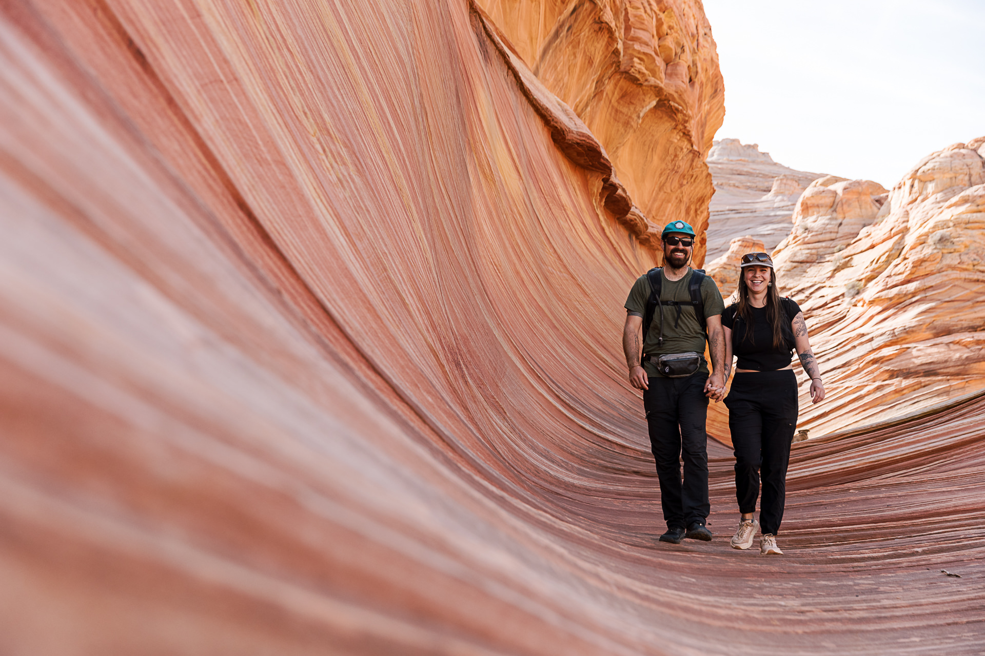 Hikers walking into the sandstone formations